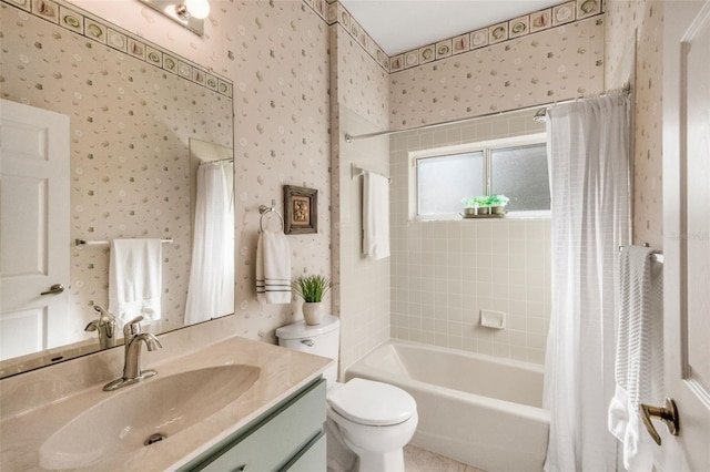 bathroom featuring toilet, wallpapered walls, shower / bath combo, and vanity