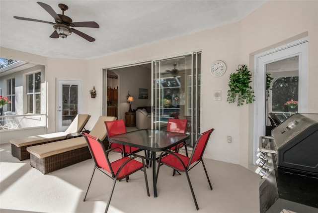 view of patio / terrace with ceiling fan and outdoor dining space