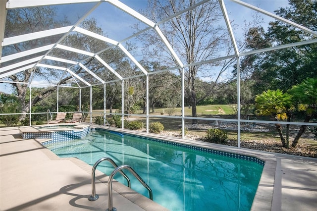 pool featuring an in ground hot tub, a patio, and glass enclosure