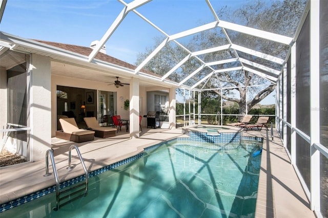 view of swimming pool with a ceiling fan, a lanai, a grill, a patio area, and a pool with connected hot tub