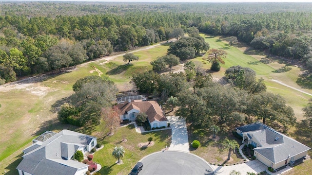 drone / aerial view featuring a forest view