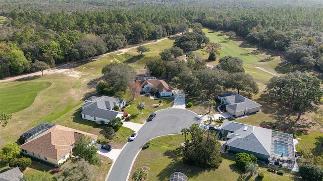 birds eye view of property featuring a wooded view