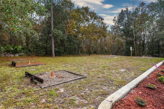 view of yard with a view of trees