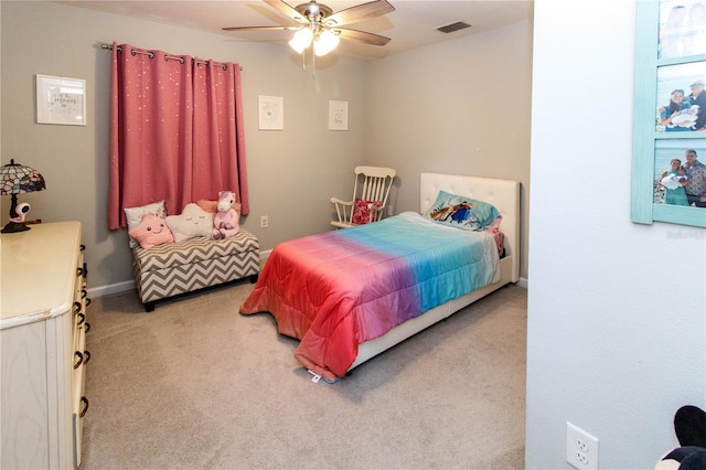 bedroom featuring visible vents, baseboards, ceiling fan, and carpet flooring