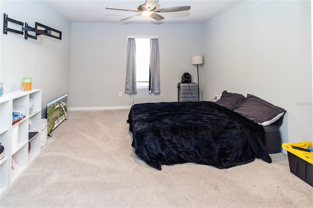 bedroom featuring baseboards, carpet floors, and ceiling fan