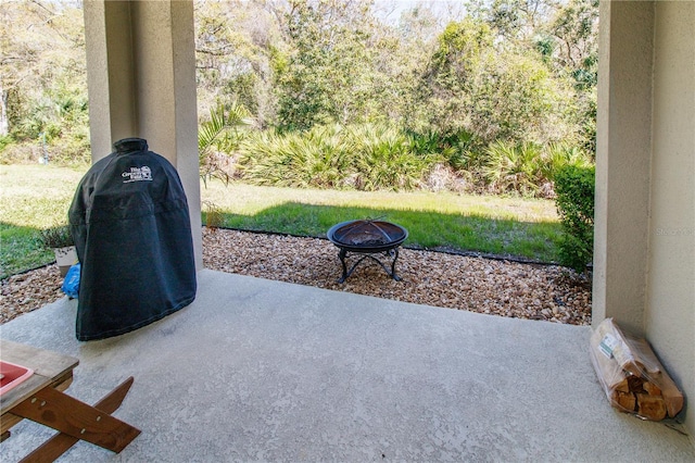 view of patio / terrace with a fire pit