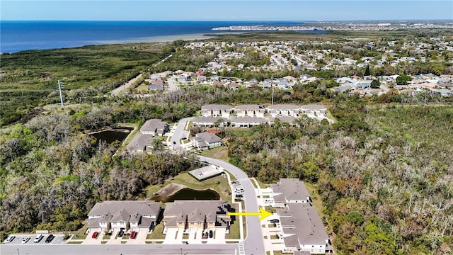 bird's eye view featuring a residential view and a water view