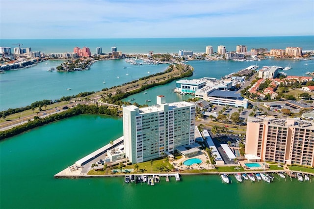 drone / aerial view with a city view and a water view