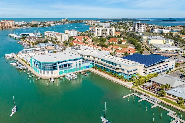 birds eye view of property featuring a water view and a city view