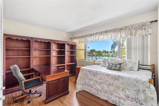 bedroom with light wood-style floors