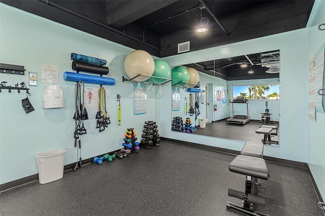 workout area featuring visible vents and baseboards