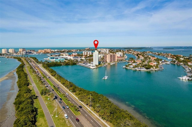 birds eye view of property featuring a water view and a city view