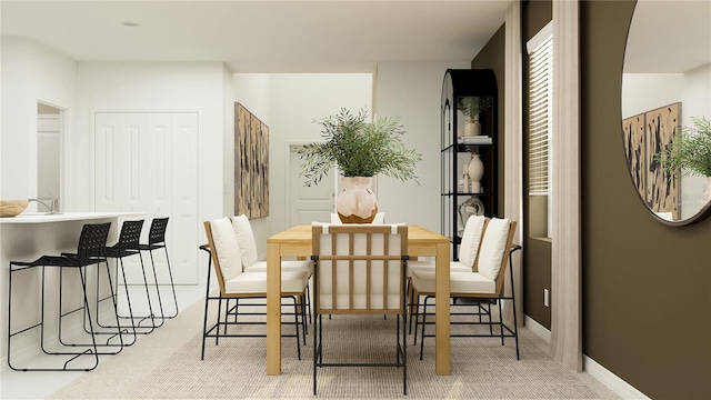 dining area featuring baseboards