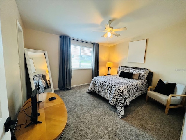 carpeted bedroom featuring a ceiling fan and baseboards