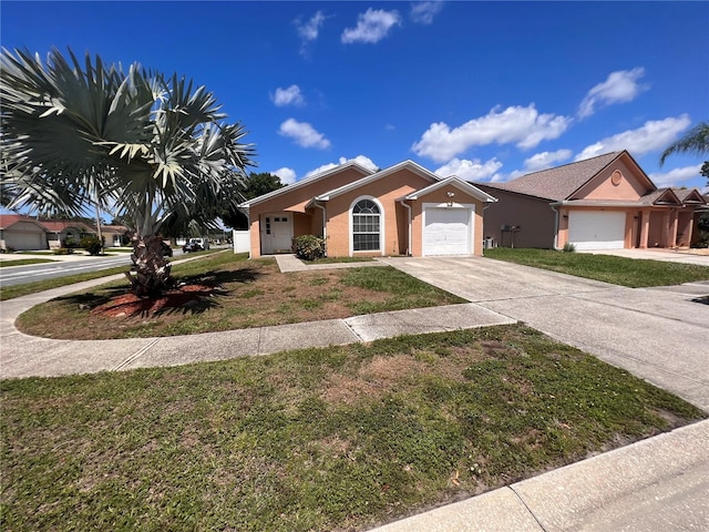 single story home with a garage, driveway, a front lawn, and stucco siding