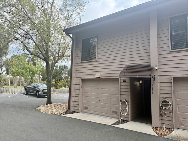 view of side of property with a garage