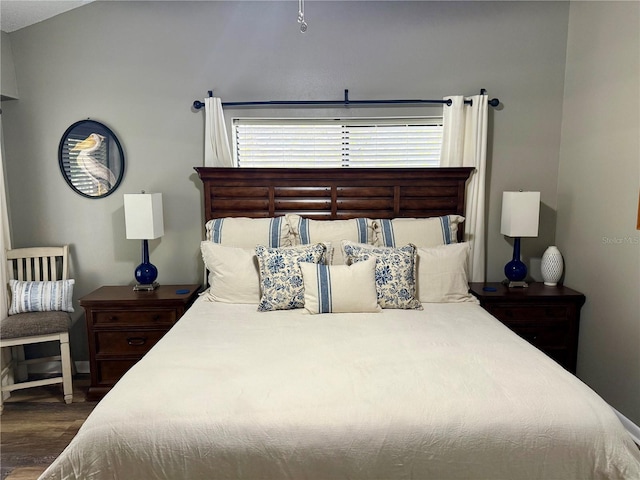 bedroom featuring dark wood-style floors