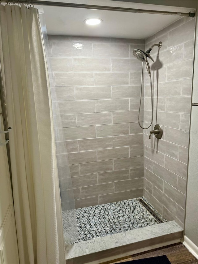 full bath featuring a shower stall