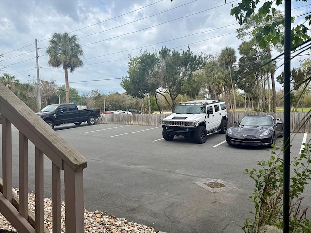 uncovered parking lot with fence