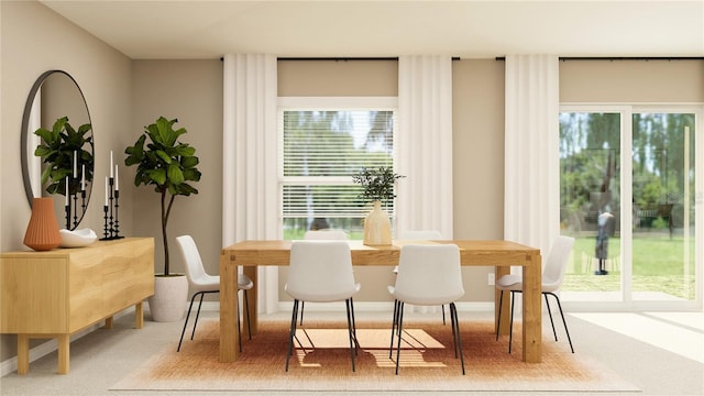 carpeted dining room with baseboards