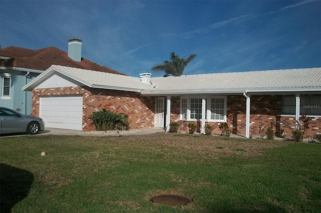 single story home featuring a garage, brick siding, a chimney, and a front lawn