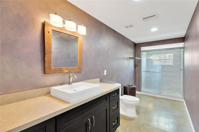 bathroom with visible vents, toilet, walk in shower, and vanity