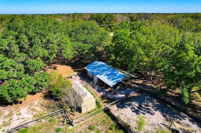 aerial view featuring a wooded view