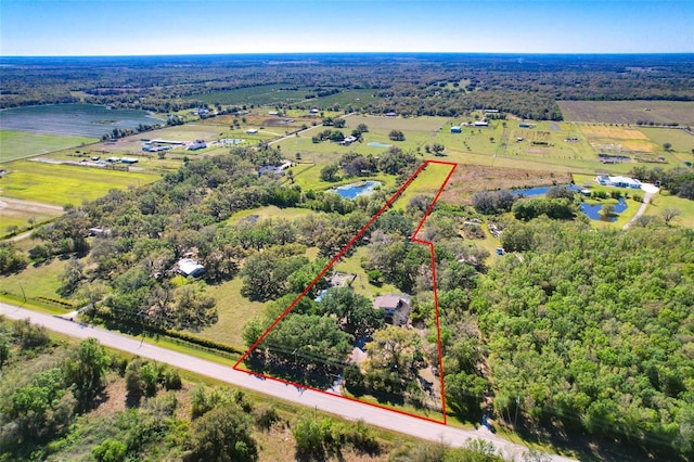 drone / aerial view featuring a rural view and a water view