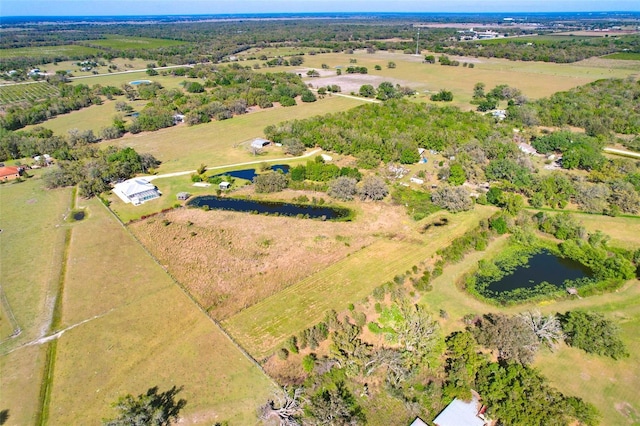 birds eye view of property with a rural view