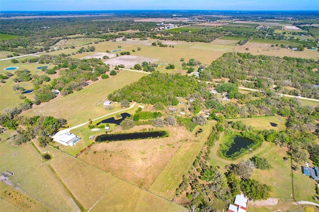 birds eye view of property with a rural view