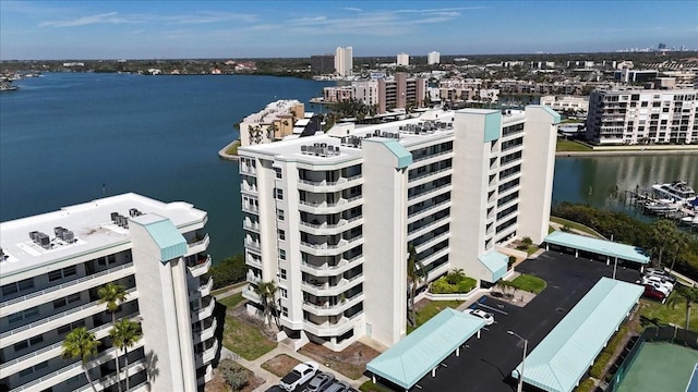 drone / aerial view featuring a view of city and a water view