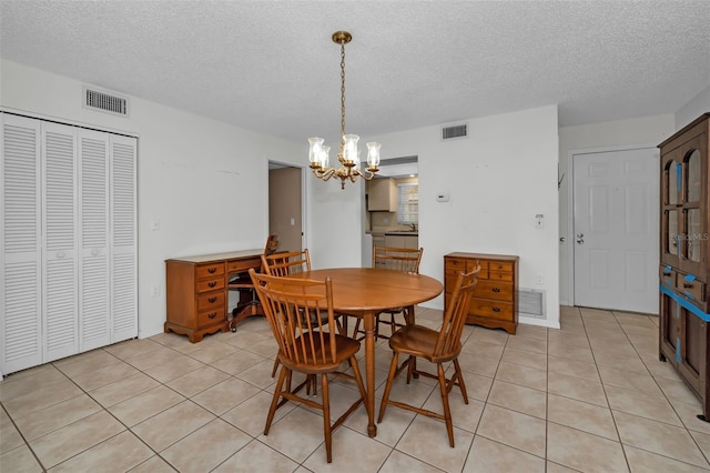 dining room featuring visible vents and light tile patterned floors