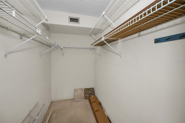 spacious closet featuring visible vents