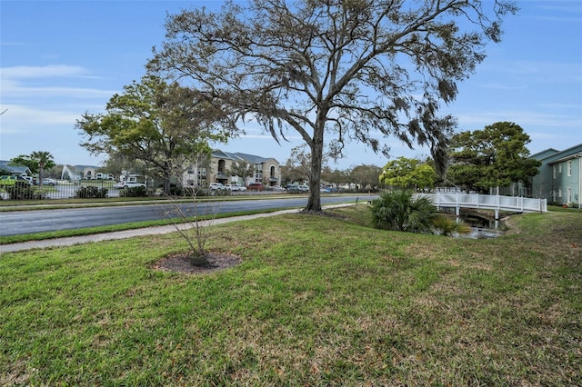 view of yard featuring a residential view and fence