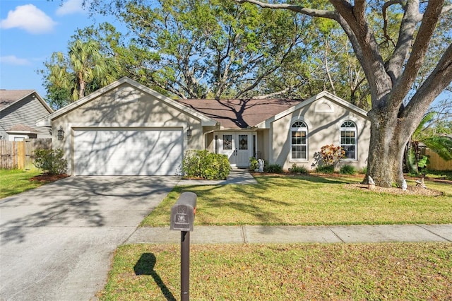 ranch-style house featuring driveway, a front lawn, an attached garage, and fence