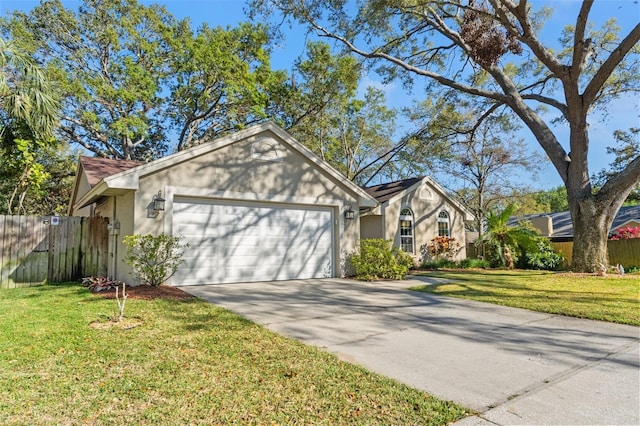 ranch-style house featuring stucco siding, concrete driveway, a front yard, fence, and a garage