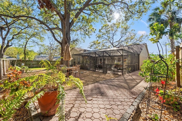 view of patio / terrace with a lanai and a fenced backyard