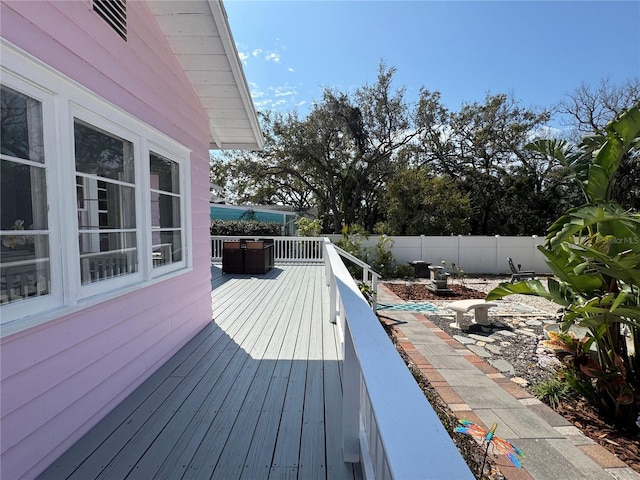 wooden deck featuring fence