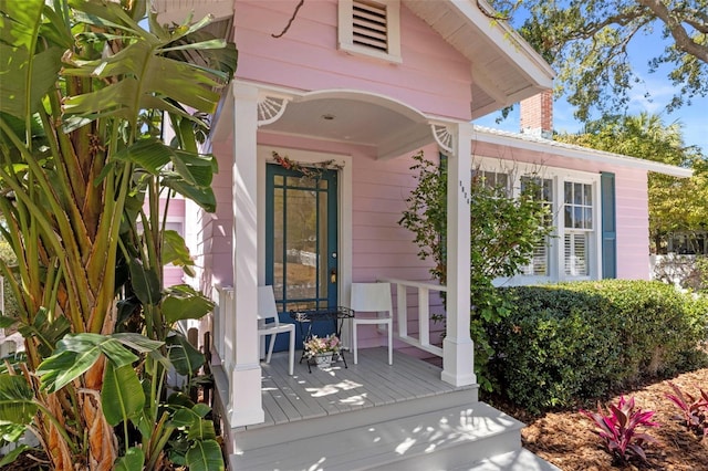 doorway to property featuring covered porch