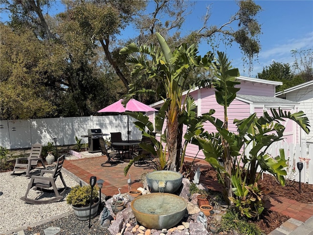 view of yard with a patio and fence