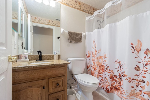 bathroom with curtained shower, visible vents, toilet, a textured ceiling, and vanity