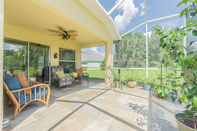 sunroom with a ceiling fan