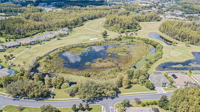 drone / aerial view featuring view of golf course and a water view