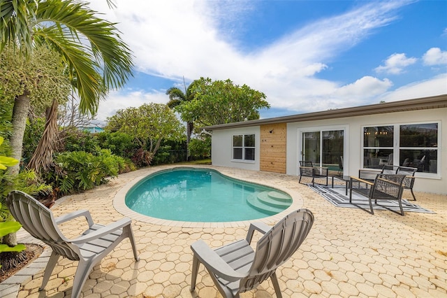 view of pool with a patio area and a fenced in pool