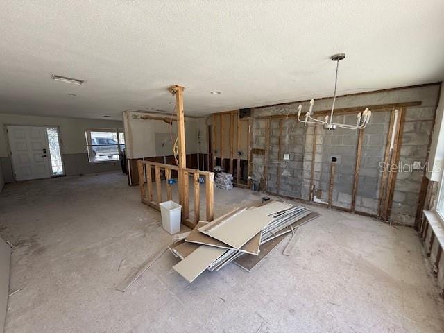 below grade area featuring a textured ceiling