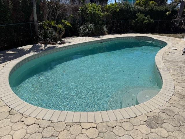 view of swimming pool featuring a patio area and a fenced in pool