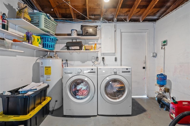 laundry area featuring electric panel, laundry area, washing machine and dryer, and electric water heater