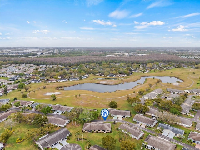 birds eye view of property featuring a water view and view of golf course