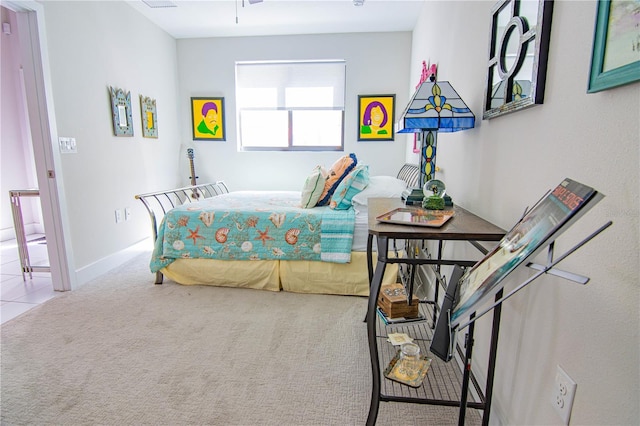 bedroom with carpet floors and baseboards