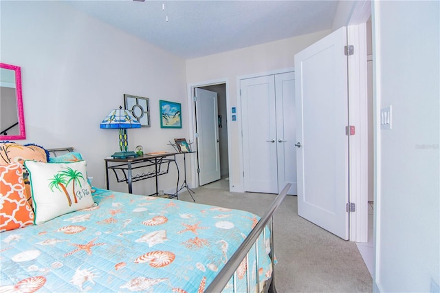 carpeted bedroom featuring a closet